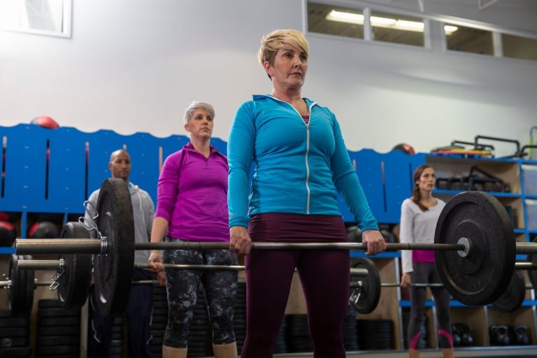 Osteoporosis exercise program participants performing supervised deadlift at Melbourne exercise physiology clinic for bone density improvement