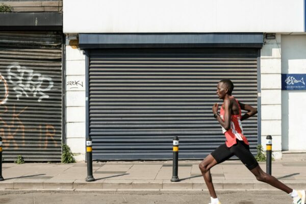 Return to running program by runner progressing through Melbourne training environments from grass to pavement