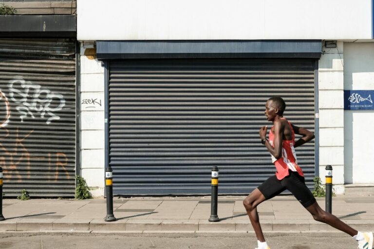 Return to running program by runner progressing through Melbourne training environments from grass to pavement